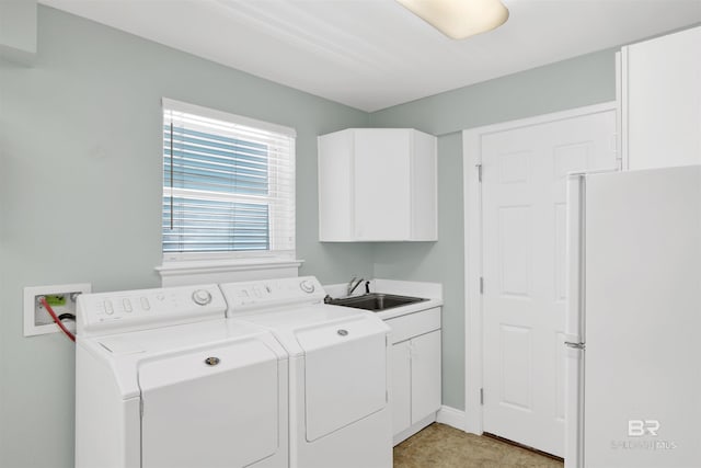 1219 Parasol Pl, Perdido Key, FL 32507 - laundry area with cabinet space, washer and dryer, and baseboards