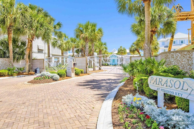 1219 Parasol Pl, Perdido Key, FL 32507 - view of decorative road featuring a gate, a residential view, a gated entry, and curbs