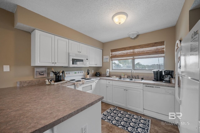 kitchen with white cabinetry, sink, white appliances, kitchen peninsula, and a textured ceiling