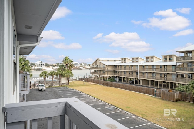 balcony featuring a water view