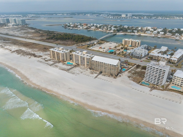 aerial view featuring a water view and a beach view