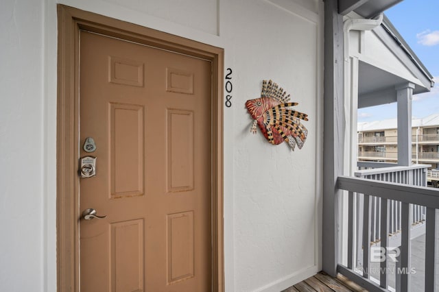 entrance to property with a balcony