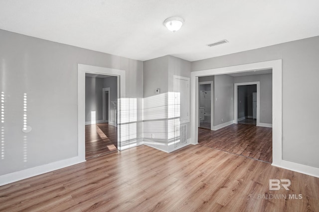 unfurnished room featuring light wood-type flooring