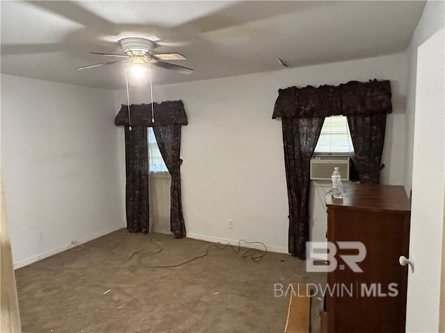 unfurnished bedroom featuring cooling unit and ceiling fan