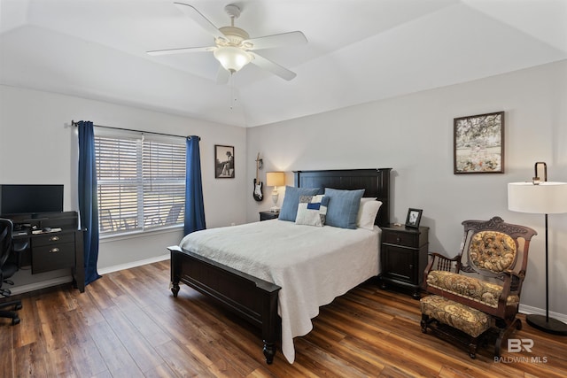 bedroom featuring baseboards, a ceiling fan, and dark wood-style flooring