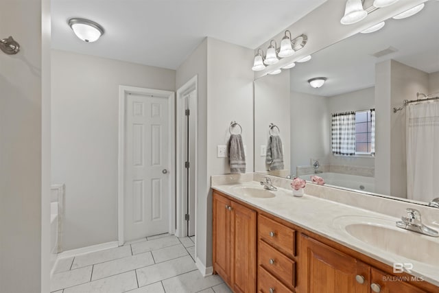 full bathroom with a sink, visible vents, double vanity, and a washtub