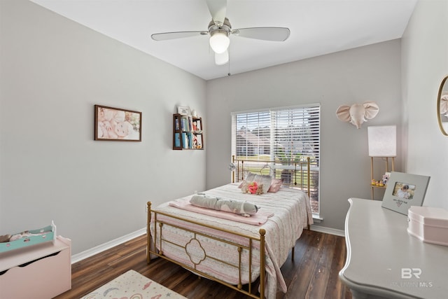 bedroom with wood finished floors, baseboards, and ceiling fan