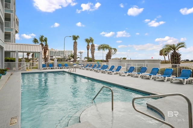 pool featuring a patio area and fence