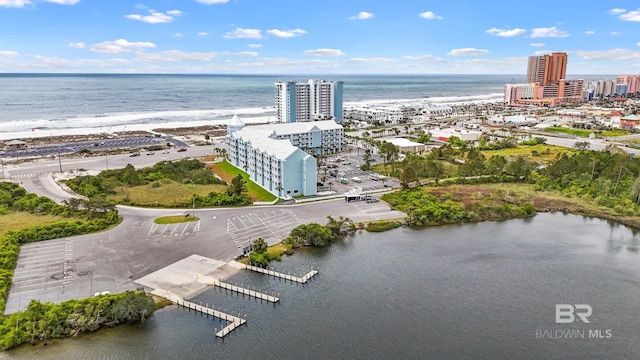 birds eye view of property featuring a view of city and a water view