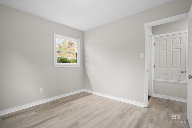 spare room featuring light wood-type flooring