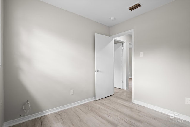 unfurnished bedroom with light wood-type flooring