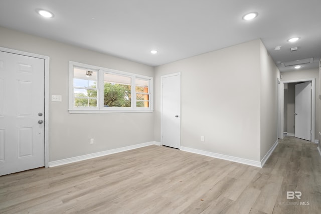 foyer entrance with light hardwood / wood-style flooring