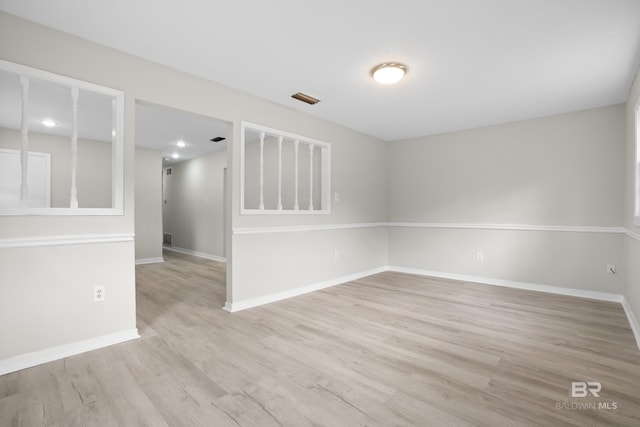 spare room featuring light hardwood / wood-style floors