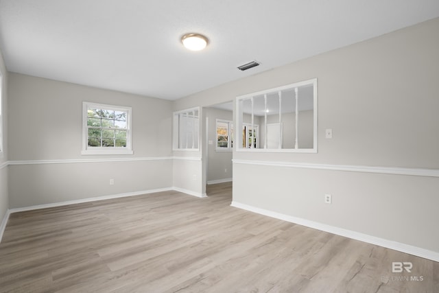 unfurnished room featuring light wood-type flooring