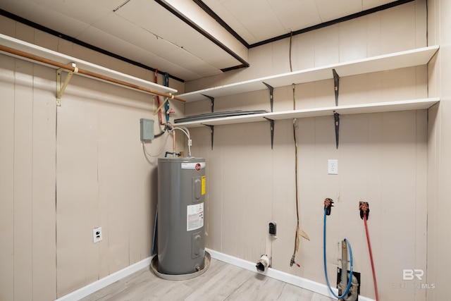 utility room featuring electric water heater