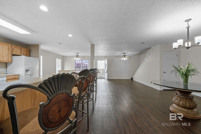 5584 Pensacola Ave, Orange Beach, AL 36561 - dining room featuring dark wood-style flooring, a textured ceiling, recessed lighting, and baseboards