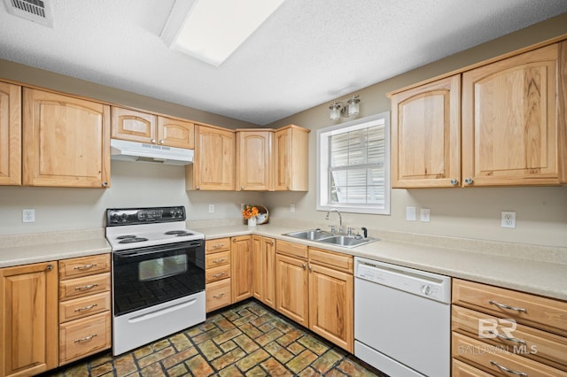 5584 Pensacola Ave, Orange Beach, AL 36561 - kitchen with white appliances, light brown cabinetry, under cabinet range hood, and a sink