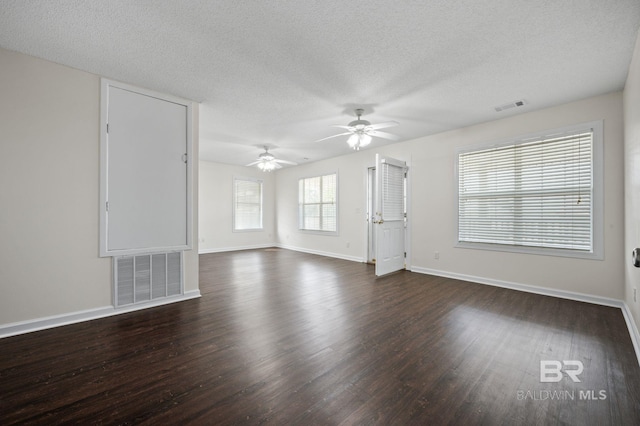 5584 Pensacola Ave, Orange Beach, AL 36561 - unfurnished living room featuring visible vents, a ceiling fan, baseboards, and dark wood-style floors
