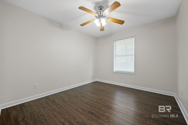 5584 Pensacola Ave, Orange Beach, AL 36561 - unfurnished room with dark wood-style flooring, baseboards, and ceiling fan