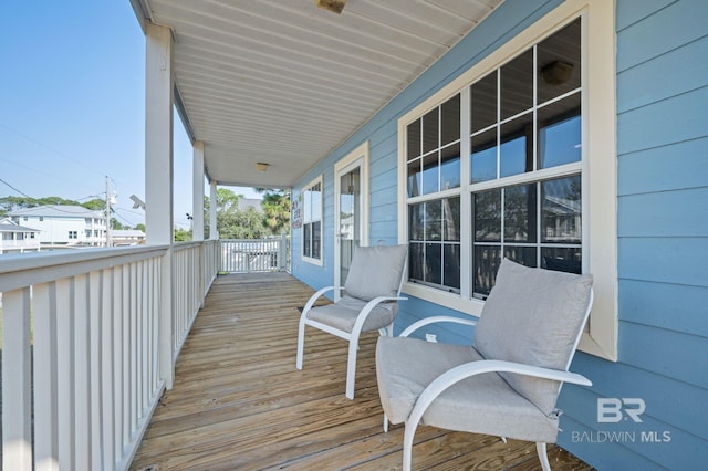 5584 Pensacola Ave, Orange Beach, AL 36561 - wooden terrace with covered porch