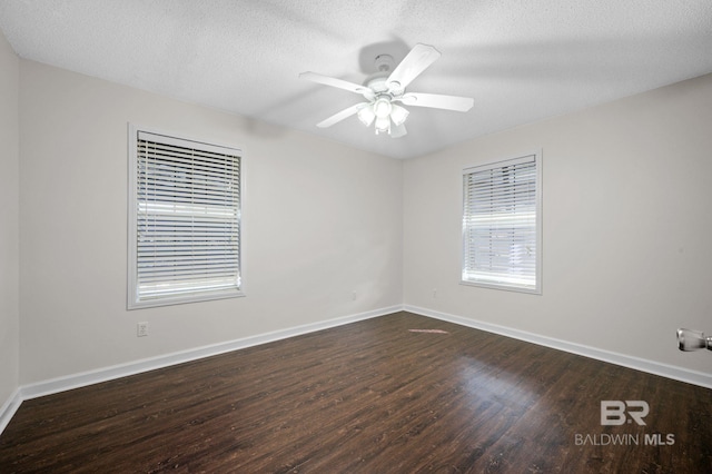 5584 Pensacola Ave, Orange Beach, AL 36561 - unfurnished room featuring baseboards, a ceiling fan, and dark wood-style flooring