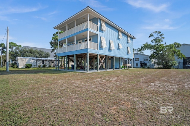 5584 Pensacola Ave, Orange Beach, AL 36561 - back of house with a lawn