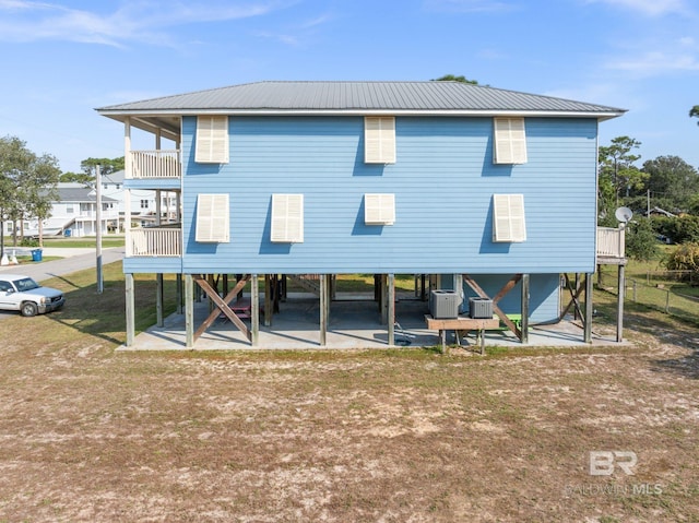 5584 Pensacola Ave, Orange Beach, AL 36561 - rear view of property featuring metal roof and a carport