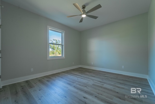 11341 Tall Timber Ln, Elberta, AL 36530 - empty room featuring wood finished floors and a ceiling fan