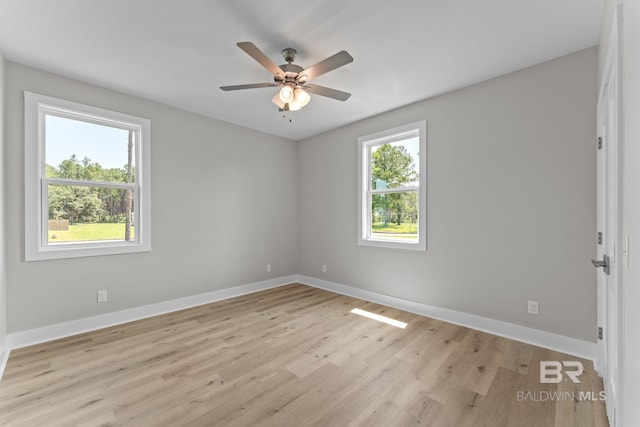 11341 Tall Timber Ln, Elberta, AL 36530 - empty room with light wood-style flooring and ceiling fan