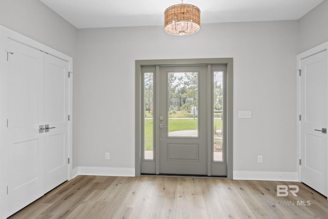 11341 Tall Timber Ln, Elberta, AL 36530 - foyer featuring wood finished floors and a chandelier