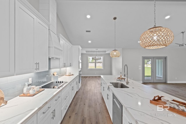 11341 Tall Timber Ln, Elberta, AL 36530 - kitchen featuring appliances with stainless steel finishes, light wood finished floors, white cabinetry, tasteful backsplash, and recessed lighting