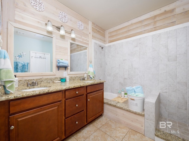 bathroom featuring vanity, walk in shower, and tile patterned floors