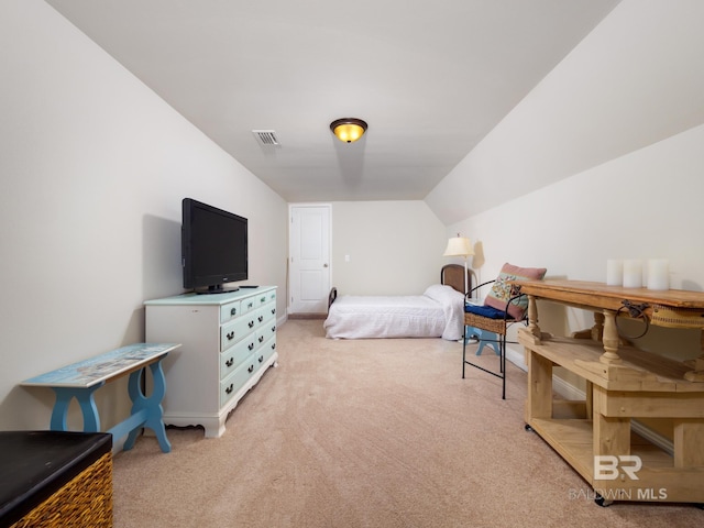 carpeted bedroom with vaulted ceiling