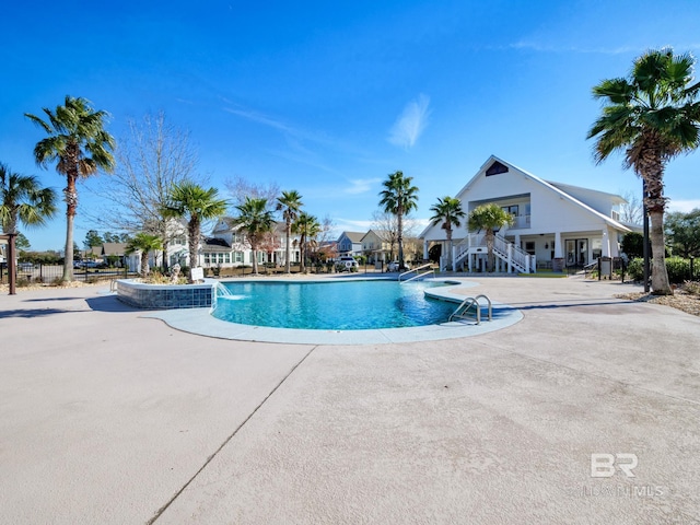 view of swimming pool featuring a patio area