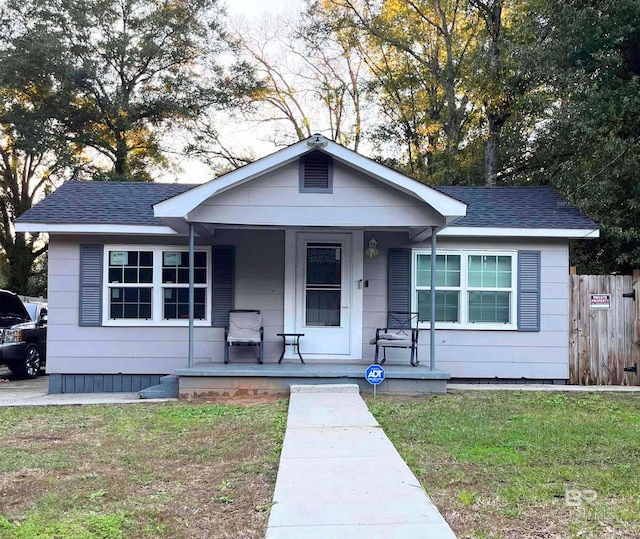 bungalow-style home featuring a front yard and a porch