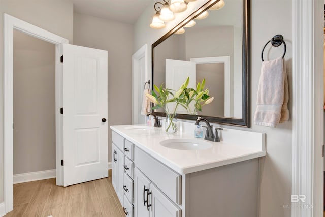 bathroom with vanity and wood-type flooring