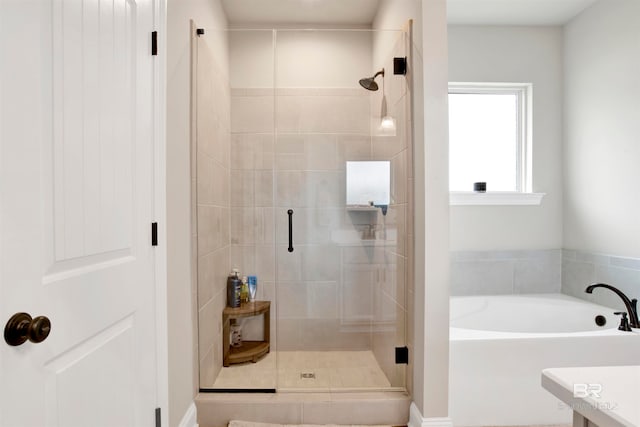 bathroom with plus walk in shower and vanity