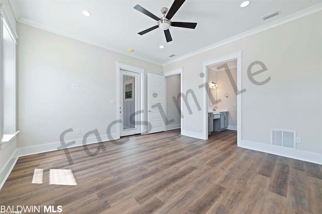 unfurnished bedroom with ornamental molding, dark hardwood / wood-style flooring, and ensuite bathroom