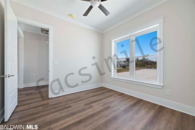 spare room with ceiling fan, dark hardwood / wood-style floors, and crown molding