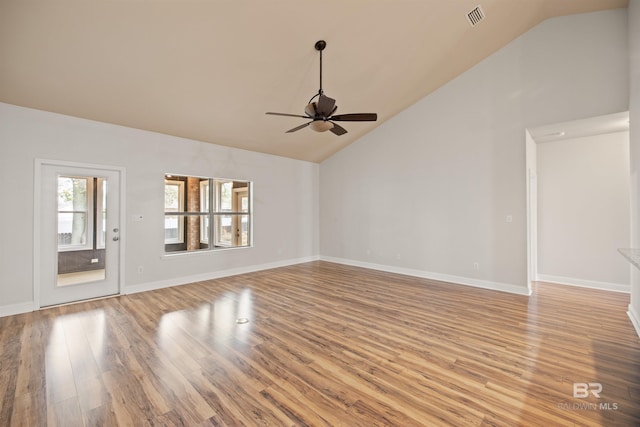 unfurnished living room featuring ceiling fan, high vaulted ceiling, and light wood-type flooring
