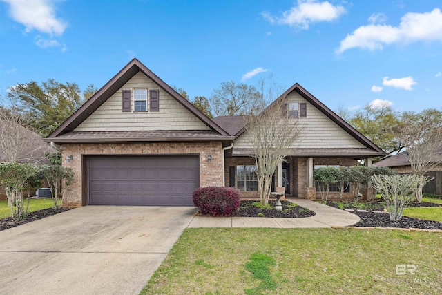 view of front of house featuring a garage, a front yard, and central air condition unit