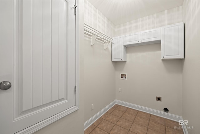 laundry area with cabinets, washer hookup, hookup for an electric dryer, and tile patterned floors