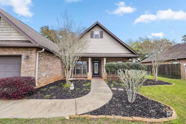 view of front of home with a garage and a porch