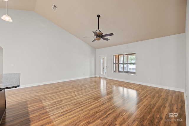unfurnished living room featuring hardwood / wood-style flooring, high vaulted ceiling, and ceiling fan
