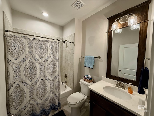 full bathroom featuring toilet, shower / bath combo with shower curtain, vanity, and visible vents