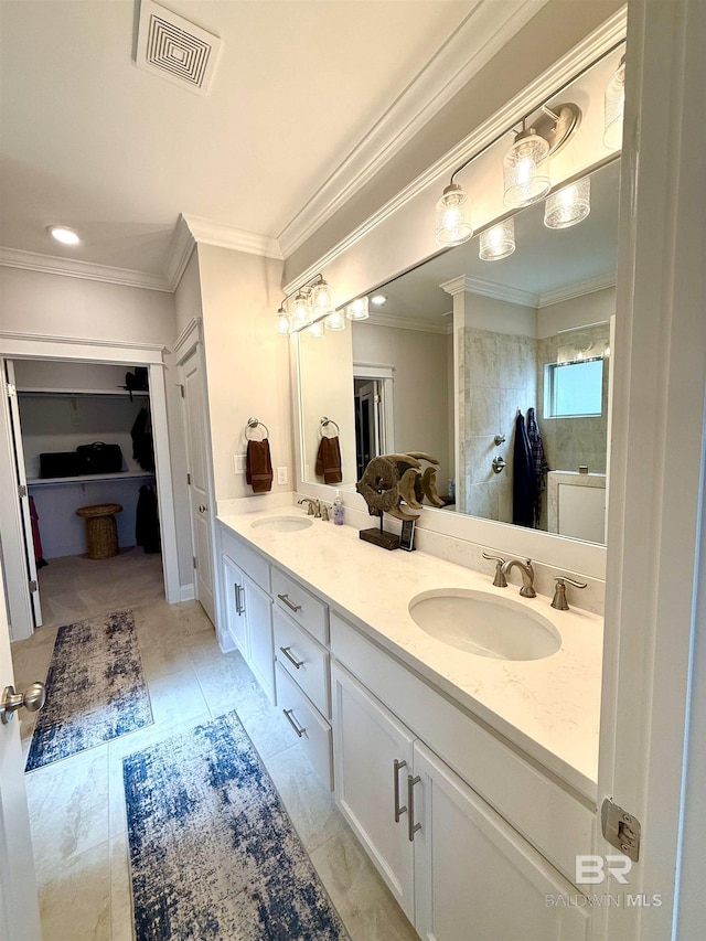 full bath featuring double vanity, a closet, visible vents, and a sink