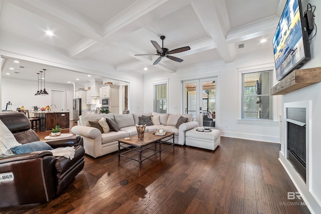 living room with dark hardwood / wood-style flooring, beam ceiling, french doors, and coffered ceiling