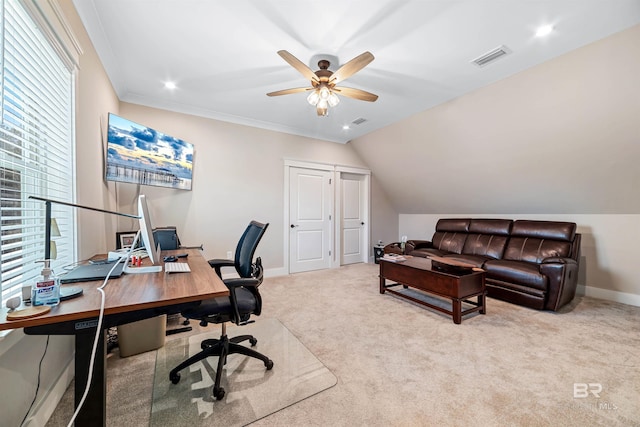 office space featuring ornamental molding, ceiling fan, light colored carpet, and vaulted ceiling