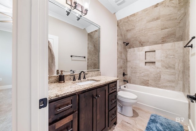 full bathroom featuring toilet, vanity, and tiled shower / bath combo