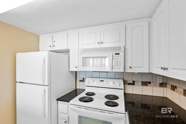 kitchen featuring decorative backsplash, white appliances, and white cabinets